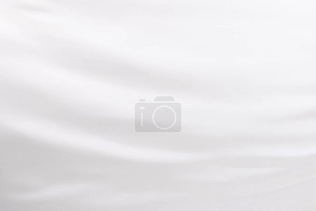 Foto de Primer plano de tela de seda brillante blanca con fondo de espacio de copia. Textura, tela, tela, color y material. - Imagen libre de derechos