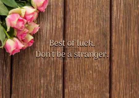 Photo for Composite of best of luck, don't be a stranger text with pink flowers on wooden table. Gift, farewell card, greeting card, aspirations, template, creative, design and leaving concept. - Royalty Free Image