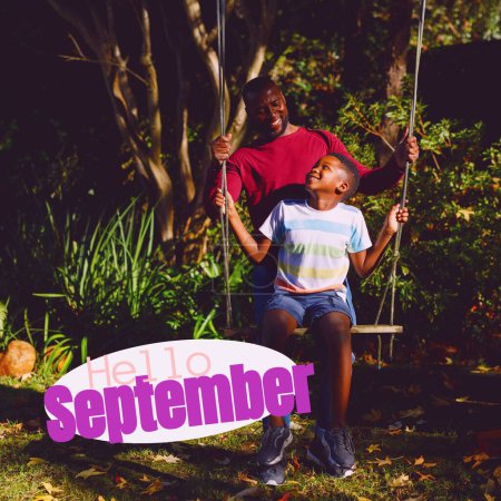 Photo for Composite of hello september text over african american father with son in garden. Hello september, fall, autumn and nature concept digitally generated image. - Royalty Free Image