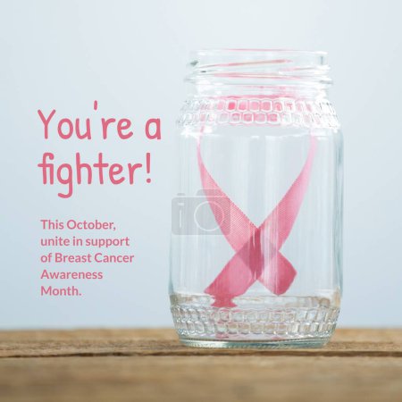 Photo for This october unite in support of breast cancer awareness month text, pink ribbon in glass jar. Composite, you're a fighter, pink october, medical, healthcare, support and prevention concept. - Royalty Free Image
