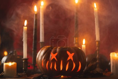 Photo for Pumpkins and candles with copy space on orange background. Fall, autumn, halloween, tradition and celebration concept. - Royalty Free Image