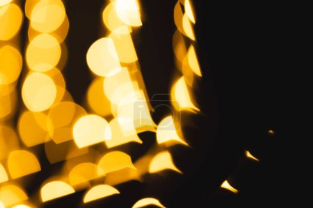 Photo for Multiple yellow bokeh lights with copy space on dark background. Light, colour and shape concept digitally generated image. - Royalty Free Image
