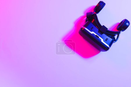 Photo for Composite of vr headset with copy space on neon background. Video game and digital connections concept digitally generated image. - Royalty Free Image
