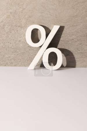 Photo for White percent sign with copy space against grey stone wall background. Black friday, cyber monday, shopping, cyber shopping, sales, retail and shipping concept. - Royalty Free Image