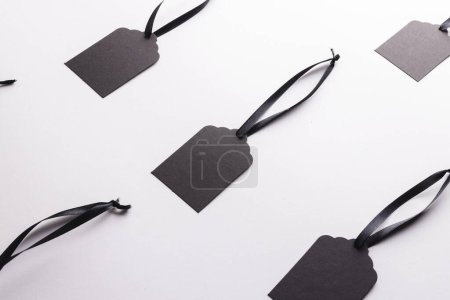 Photo for Rows of black price tags with copy space on white background. Black friday, cyber monday, shopping, cyber shopping, sales, retail and shipping concept. - Royalty Free Image
