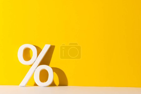 Photo for White percent sign with copy space against yellow background. Black friday, cyber monday, shopping, cyber shopping, sales, retail and shipping concept. - Royalty Free Image