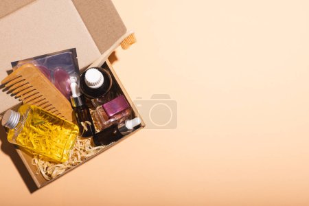 Photo for Box with beauty products and copy space over cream background. Cyber monday, black friday, online shopping, shipping and global connections concept. - Royalty Free Image