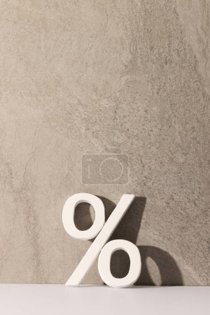 Photo for White percent sign with copy space against grey stone wall background. Black friday, cyber monday, shopping, cyber shopping, sales, retail and shipping concept. - Royalty Free Image