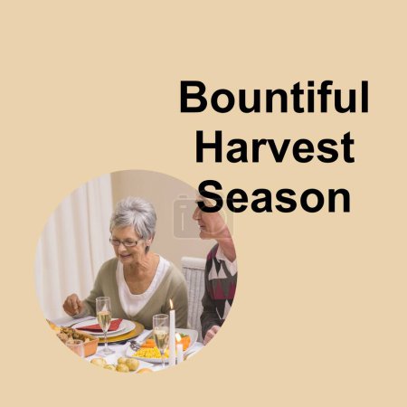 Photo for Bountiful harvest season text and happy senior caucasian couple at thanksgiving dinner. Thanksgiving, harvest festival, american tradition, family and autumn celebration digitally generated image. - Royalty Free Image