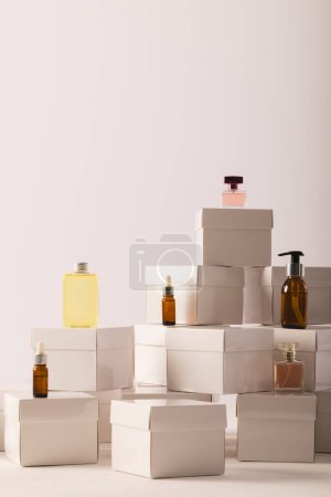 Photo for Vertical image of boxes with beauty products and copy space over white background. Cyber monday, black friday, online shopping, shipping and global connections concept. - Royalty Free Image