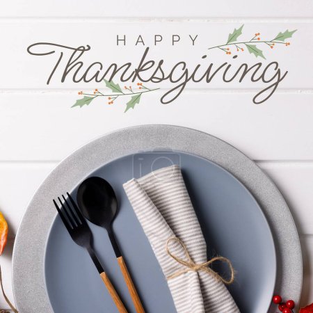 Photo for Composite of happy thanksgiving text over place setting with cutlery and plates. Thanksgiving, american tradition and celebration, autumn, fall concept digitally generated image. - Royalty Free Image