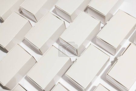 Photo for Rows of cardboard gift boxes with copy space over white background. Cyber monday, black friday, online shopping, shipping and global connections concept. - Royalty Free Image