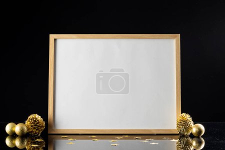 Photo for Christmas decorations and white frame with copy space on black background. Christmas, decorations, tradition and celebration concept. - Royalty Free Image