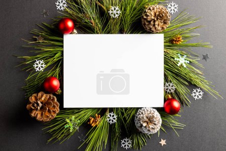 Photo for Christmas decorations with white card and copy space on black background. Christmas, decorations, tradition and celebration concept. - Royalty Free Image