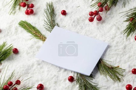 Photo for Christmas decorations and white card with copy space on snow background. Christmas, decorations, tradition and celebration concept. - Royalty Free Image