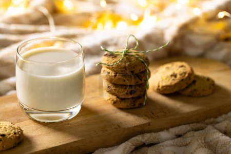 Photo for Close up of glass of milk and christmas cookies with copy space on wooden background. Sweets, christmas, tradition and celebration concept. - Royalty Free Image