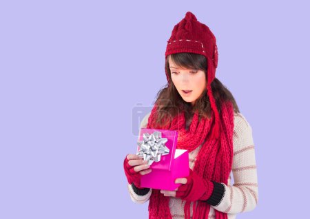 Photo for Caucasian woman opening gift box against copy space on purple background. birthday and festivity concept - Royalty Free Image