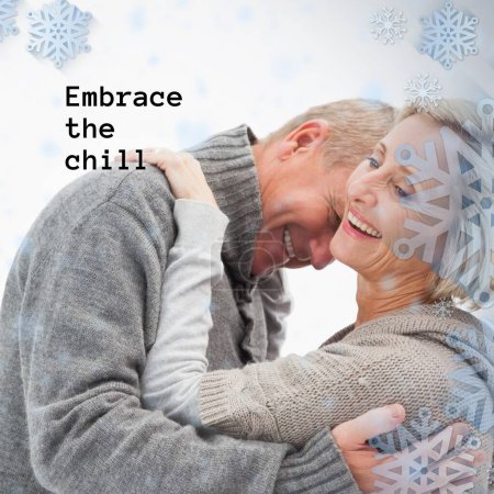 Photo for Composite of embrace the chill text over caucasian couple in winter scenery. Winter, christmas, seasons and celebration concept digitally generated image. - Royalty Free Image
