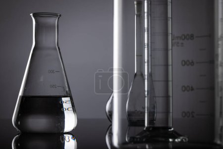 Photo for Close up of laboratory dishes and copy space on grey background. Laboratory, science, research and chemistry concept. - Royalty Free Image