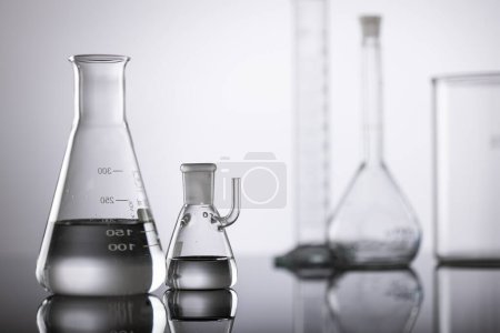 Photo for Close up of laboratory dishes and copy space on grey background. Laboratory, science, research and chemistry concept. - Royalty Free Image