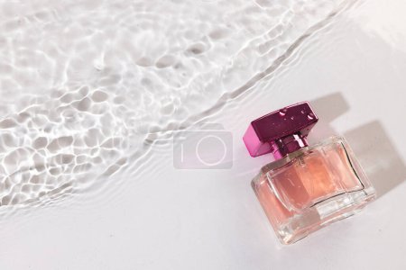 Photo for Beauty product bottle in water with copy space background on white background. Health and beauty, make up and beauty concept. - Royalty Free Image