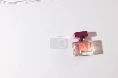 Photo for Beauty product bottle in water with copy space background on white background. Health and beauty, make up and beauty concept. - Royalty Free Image