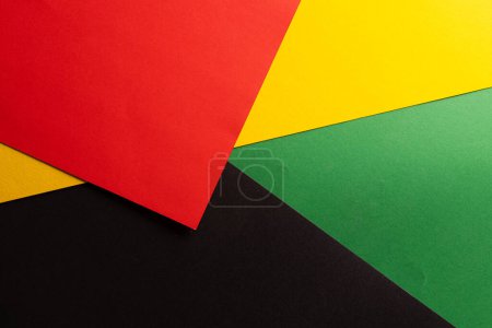 Photo for Green, yellow and red papers with copy space on black background. Black history month, africa, black culture and hsitory concept. - Royalty Free Image