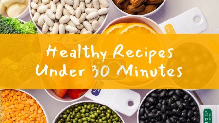 Photo for Healthy recipes under 30 minutes text on orange band over bowls of pulses and ingredients on worktop. Food, cooking, recipes and healthy lifestyle, digitally generated image. - Royalty Free Image