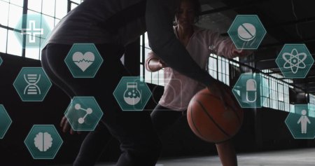 Photo for Image of medical icons over man and woman playing basketball. Digital interface global sport and performance concept digitallygenerated image. - Royalty Free Image
