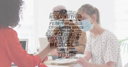 Photo for Image of words floating with colleagues in office wearing face masks. Healthcare and protection during coronavirus covid 19 pandemic, digitally generated image - Royalty Free Image