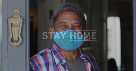 Photo for Covid-19 concept text against portrait of african american senior man welcoming on the house door. staying at home in self isolation in quarantine lockdown - Royalty Free Image