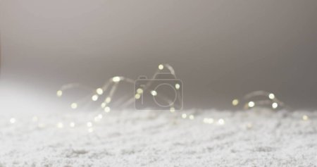 Photo for A soft focus captures twinkling fairy lights on a surface. The blurred lights create a dreamy, festive atmosphere, often used in home decor. - Royalty Free Image