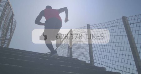 Foto de Imagen del icono de los medios de comunicación sobre el hombre afroamericano corriendo por las escaleras al aire libre. concepto de salud y estado físico imagen generada digitalmente. - Imagen libre de derechos