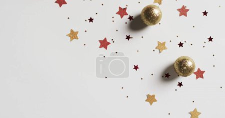 Photo for Feliz navidad text in red over stars and christmas baubles on white background. Christmas, decorations, tradition, spanish, greetings and celebration digitally generated image. - Royalty Free Image