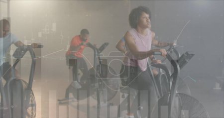 Photo for Image of data processing on graph over biracial woman cross training on elliptical at gym. Fitness, exercise, strength, data, digital interface and technology digitally generated image. - Royalty Free Image