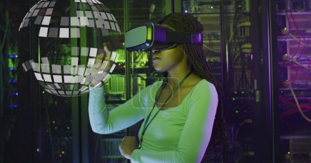 Photo for Image of globe over african american woman wearing vr headset over servers. - Royalty Free Image