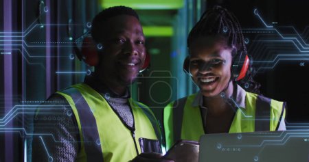 Photo for Image of integrated circuits over african american woman and man working in server room. - Royalty Free Image