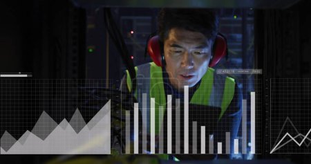 Photo for Image of graphs and data over asian man working in server room. network, programming, computers and technology concept digitally generated image. - Royalty Free Image
