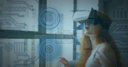 Photo for Image of scope scanning and data processing over woman wearing vr headset. digital interface, global connection and communication concept digitally generated image. - Royalty Free Image