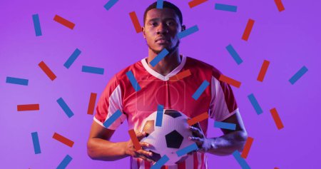 Image of african american male soccer player over confetti. Global sport and digital interface concept digitally generated image.