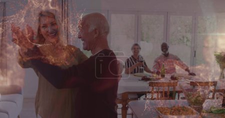 Photo for Image of spots over diverse group of seniors dancing. senior home hangout and digital interface concept digitally generated image. - Royalty Free Image