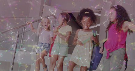 Photo for Image of networks over happy diverse schoolgirls talking on stairs. Friendship, school, education, childhood and learning, digitally generated image. - Royalty Free Image