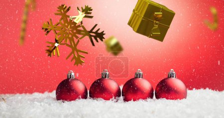 Photo for Image of candy canes and gifts christmas decorations with baubles on red background. Christmas, tradition and celebration concept digitally generated image. - Royalty Free Image