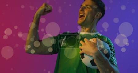 Photo for Image of caucasian male soccer player over spots. Global sport and digital interface concept digitally generated image. - Royalty Free Image
