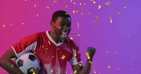 Photo for Image of african american male soccer player over confetti. Global sport and digital interface concept digitally generated image. - Royalty Free Image