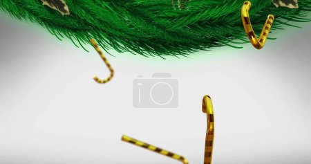 Photo for Image of candy canes christmas decorations over fir tree branches on white background. Christmas, tradition and celebration concept digitally generated image. - Royalty Free Image