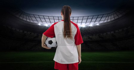 Photo for Image of caucasian female soccer player over stadium. - Royalty Free Image
