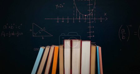 Photo for Digital image of a pile of books while mathematical equations and graphs move in the screen against a dark background - Royalty Free Image
