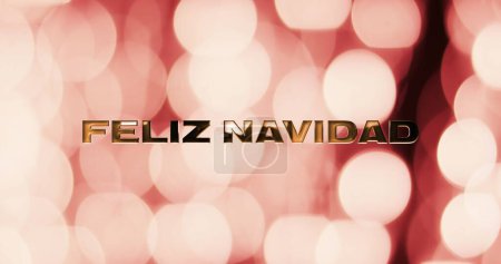Photo for Image of feliz navidad text over pink spots of light background. Christmas, tradition and celebration concept digitally generated image. - Royalty Free Image