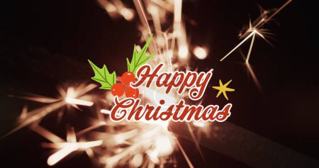 Photo for Image of happy christmas text over lit sparkler on black background. Christmas, tradition and celebration concept digitally generated image. - Royalty Free Image